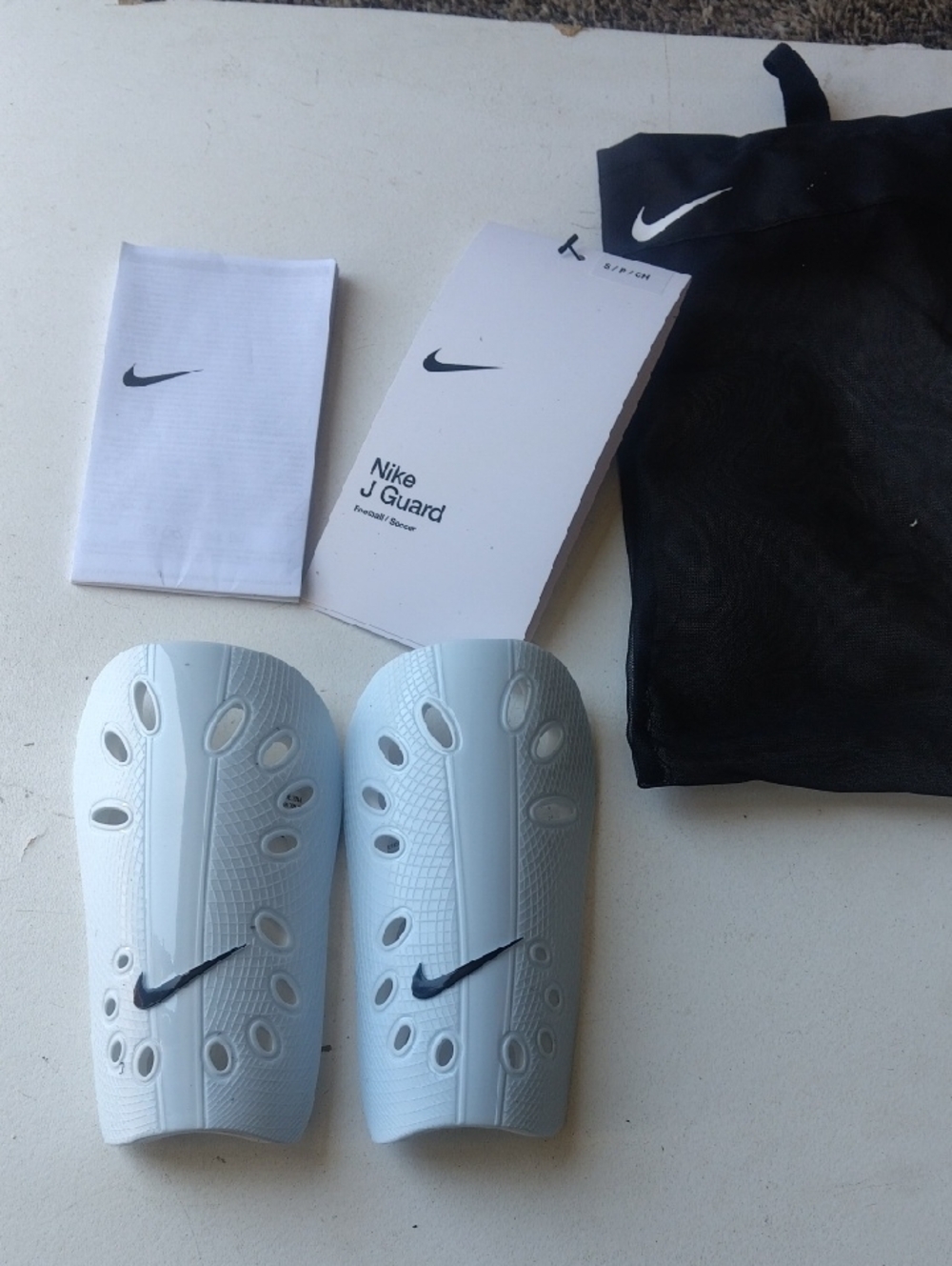 Nike White Soccer Shin Guards with Black Swoosh